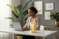 Professional home office scene with Gold Flower Glass Fragrance Oil Warmer