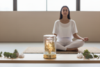 Meditation and yoga room with Middle Eastern woman and Gold Flower Glass Fragrance Oil Warmer
